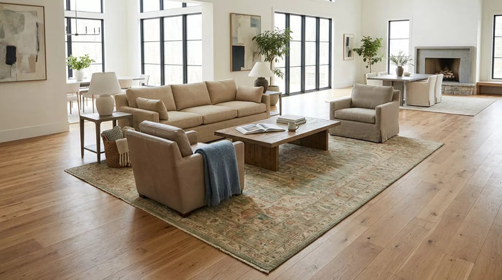 Bright great room with a 10x14 area rug anchoring a spacious living room seating layout.